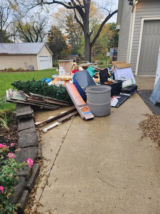 Dumpster being loaded with debris for 3 Yard Dumpster Rental in New Lebanon